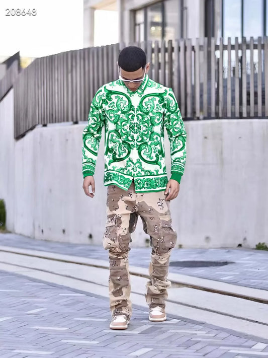 Person wearing a Green patterned hoodie and camouflage pants walking on a sidewalk.
