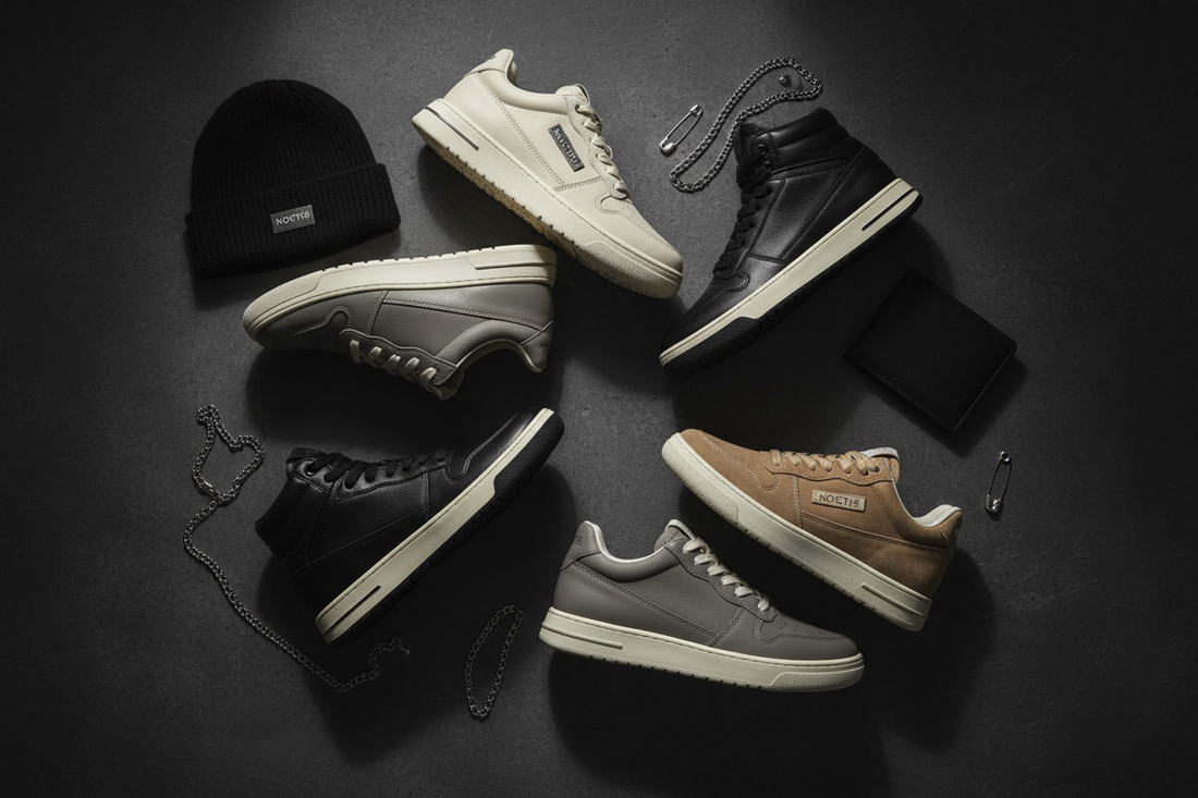 Stylish sneakers in neutral colorways arranged on a dark textured surface with dramatic side lighting, premium footwear editorial