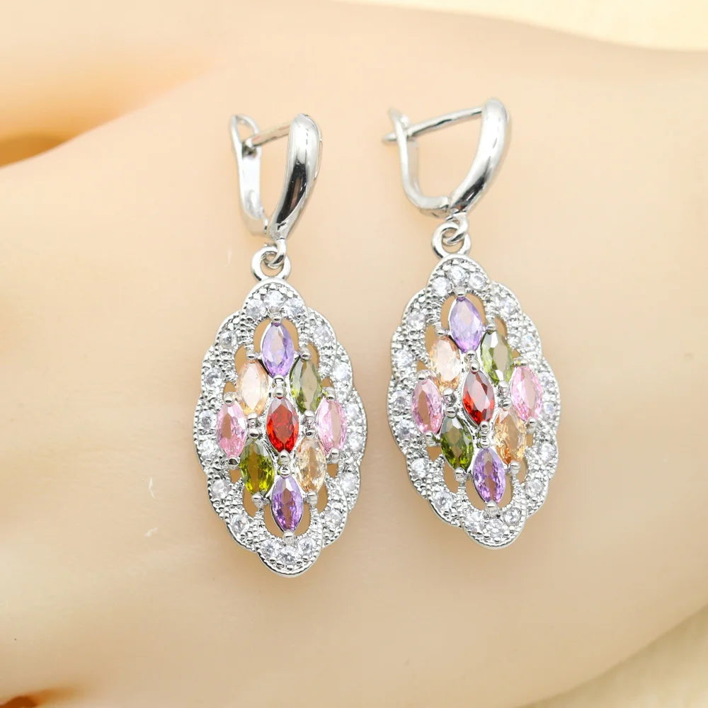 MulticoloRed gemstone earrings on a mannequin ear