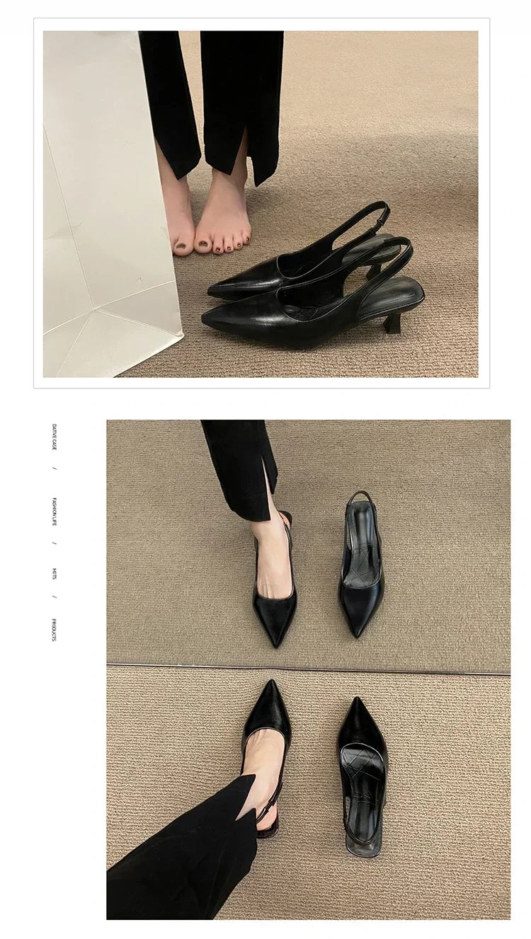 Black high-heeled shoes on a beige carpet with a person wearing Black pants.