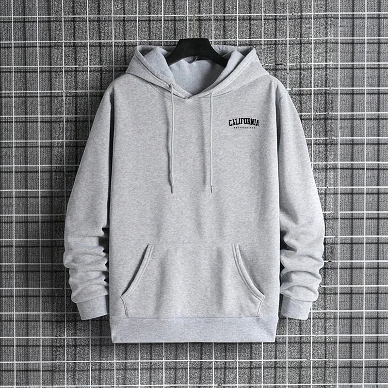 Gray hoodie with 'Everlast' logo on a hanger against a grid background