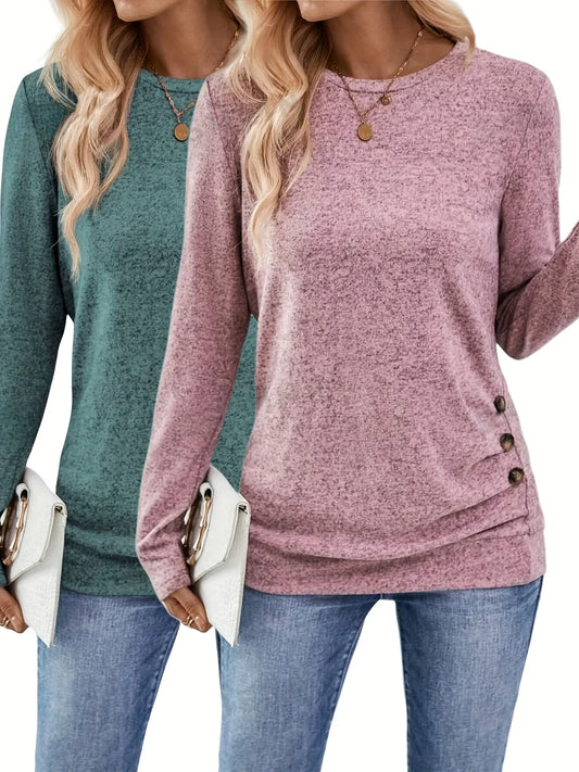 Two women wearing long-sleeve button-up shirts in Green and Pink, with Blue jeans.