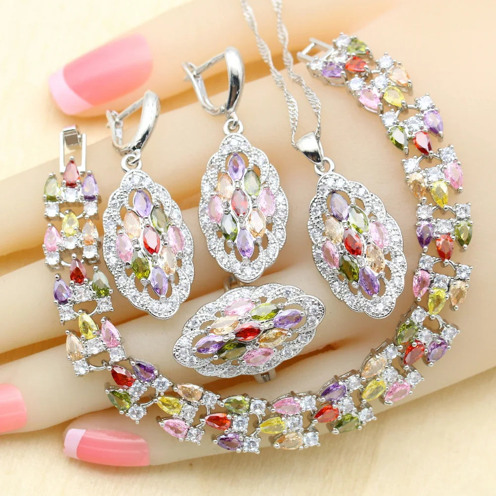 MulticoloRed gemstone jewelry set on a hand with Pink nail polish