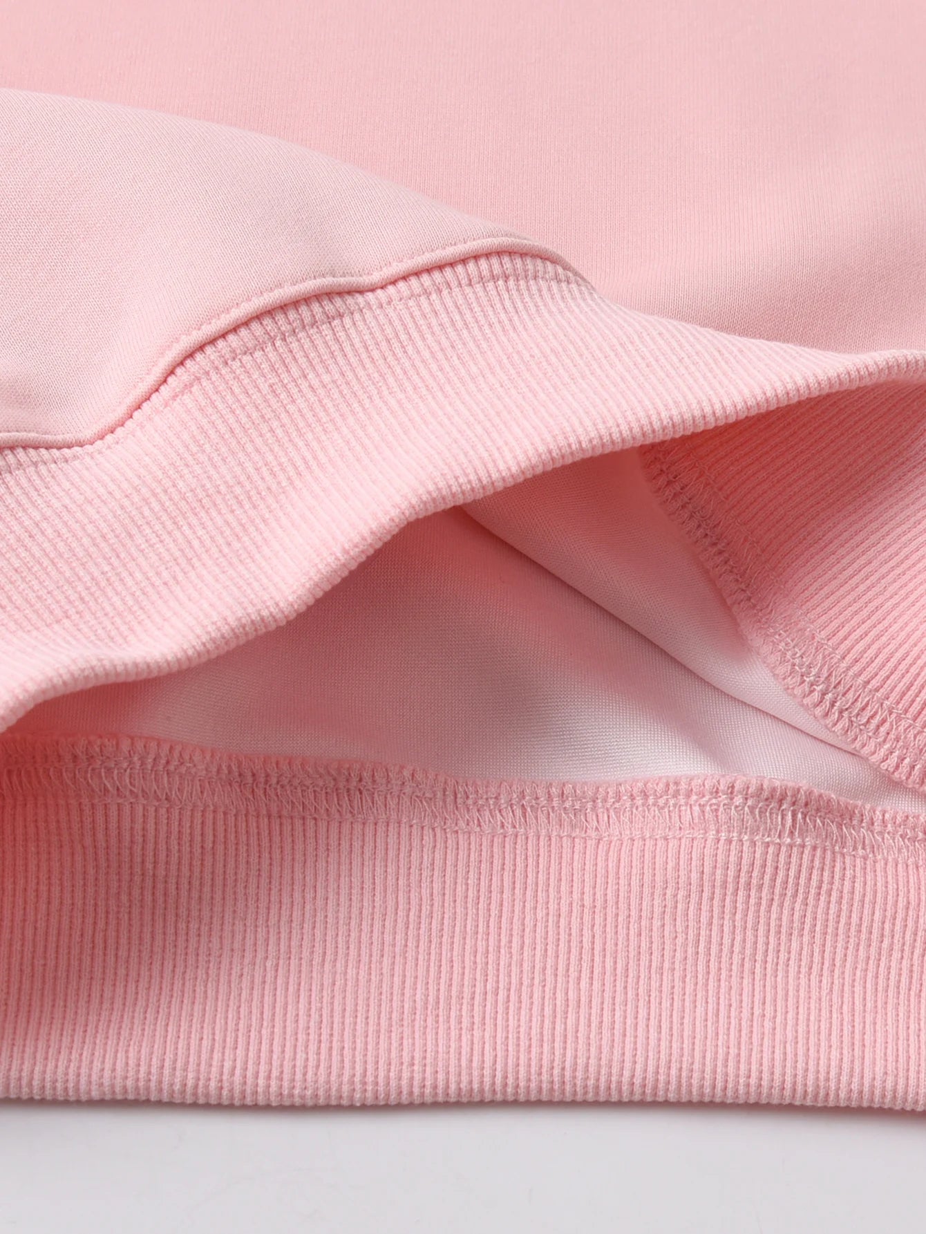 Close-up of Pink fabric texture on a light Gray background