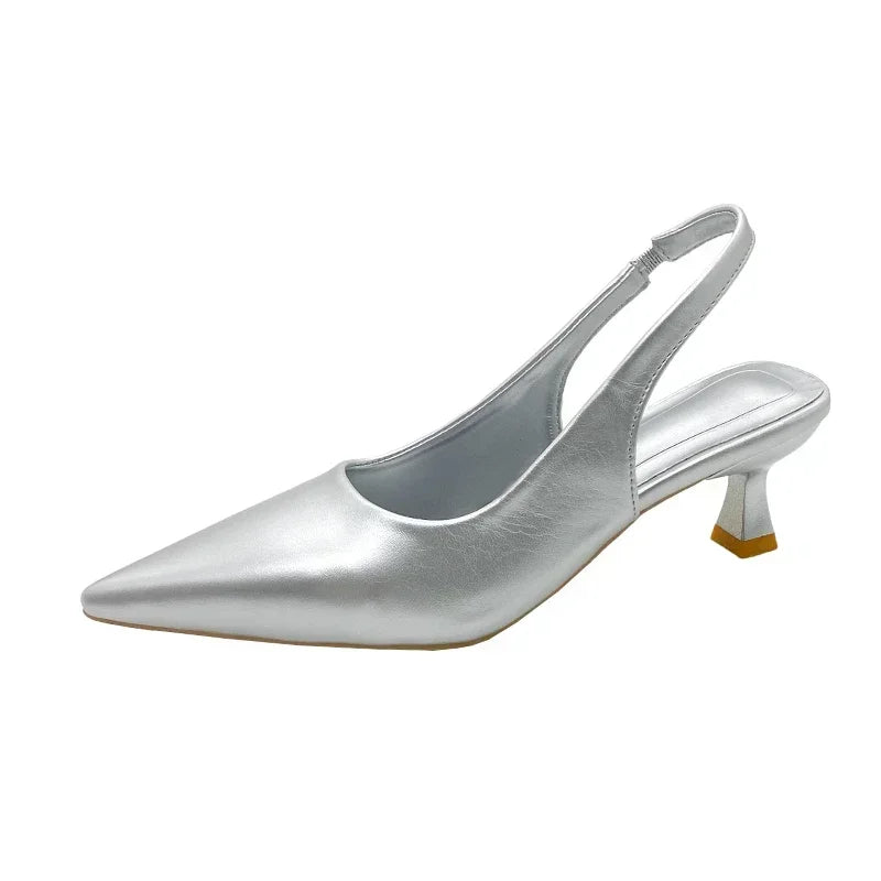 Silver slingback shoe on a White background