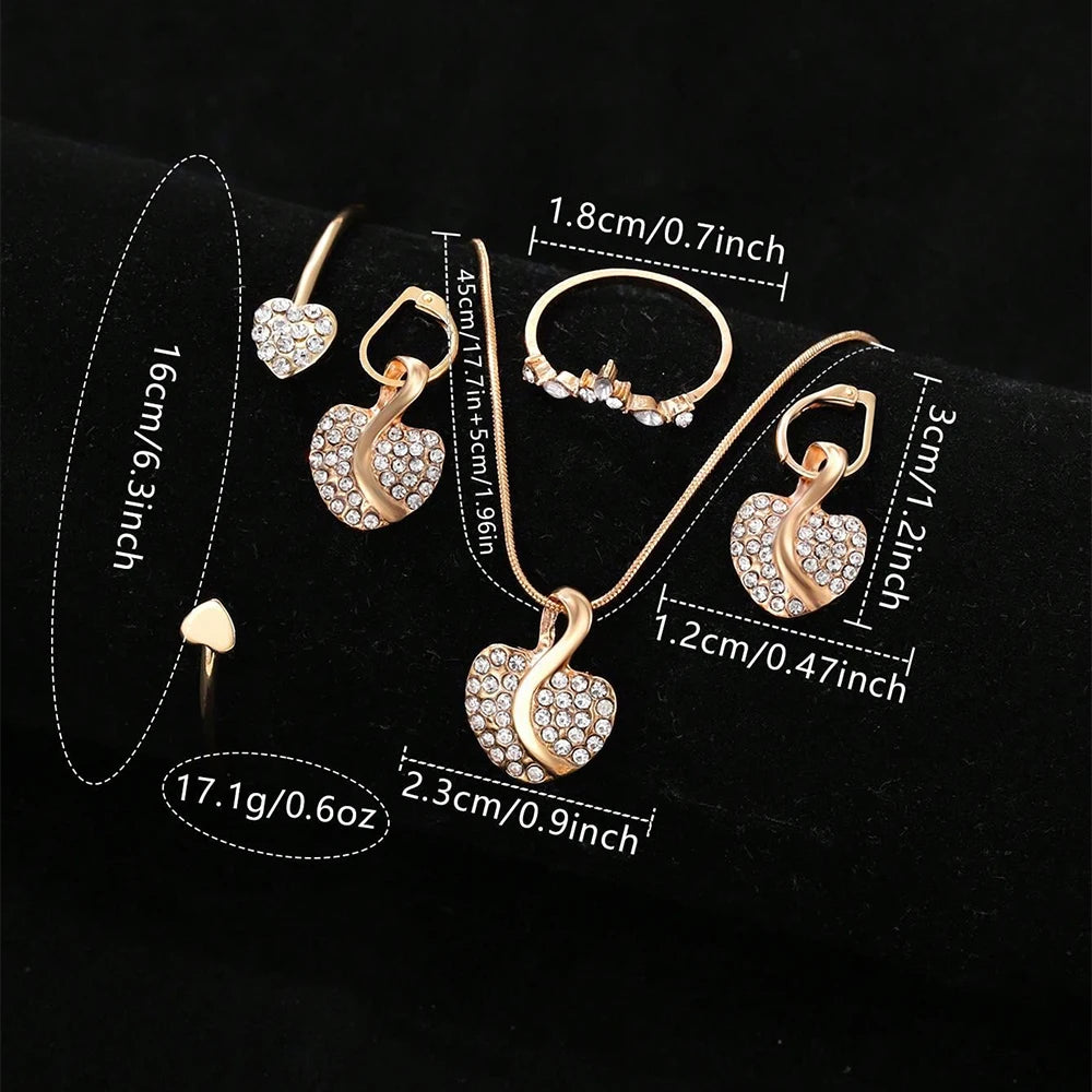 Gold heart-shaped jewelry set with measurements on a Black background