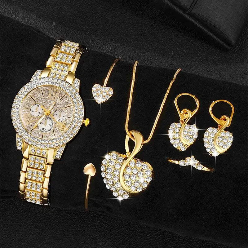 Gold jewelry set including a watch, necklace, and earrings on a Black background