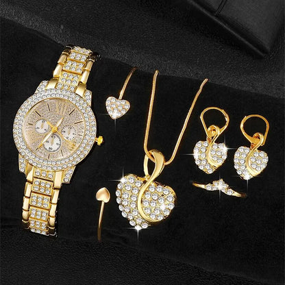 Gold jewelry set including a watch, necklace, and earrings on a Black background