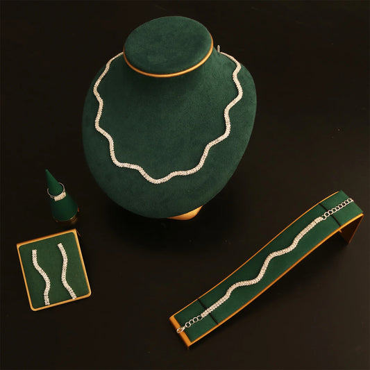 Green jewelry display box with decorative elements on a dark background