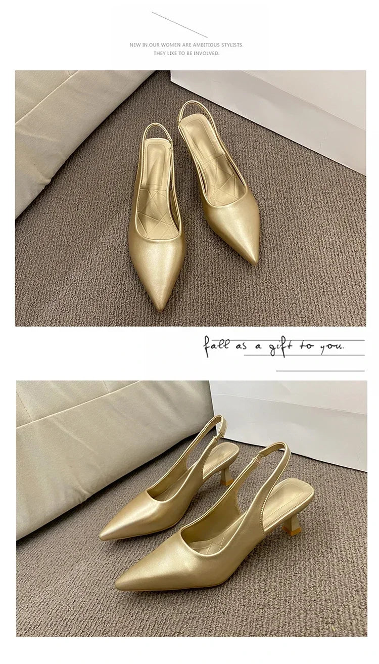 Gold high-heeled shoes on a textuRed surface with a minimal background.