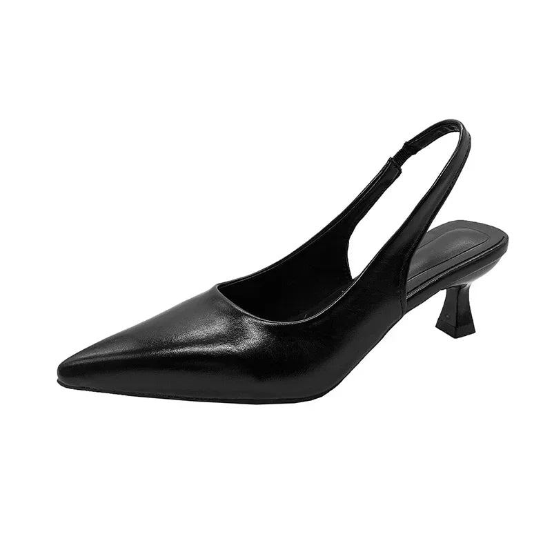 Black slingback shoe on a White background