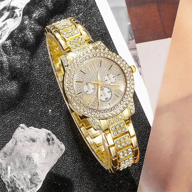 Gold wristwatch with diamond accents on a dark textuRed surface