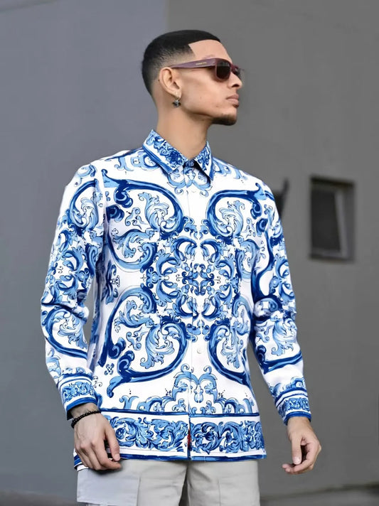 Man wearing a Blue and White patterned shirt against a Gray background