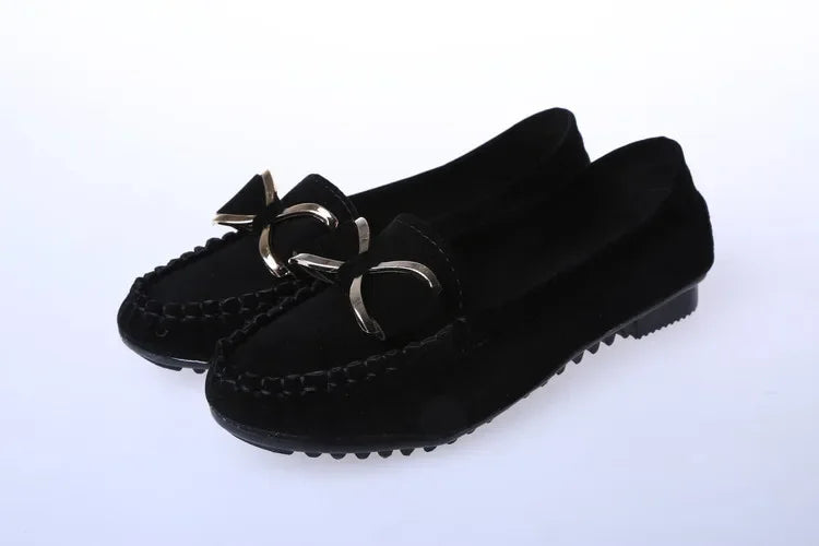 Pair of Black loafers with decorative bow on a White background