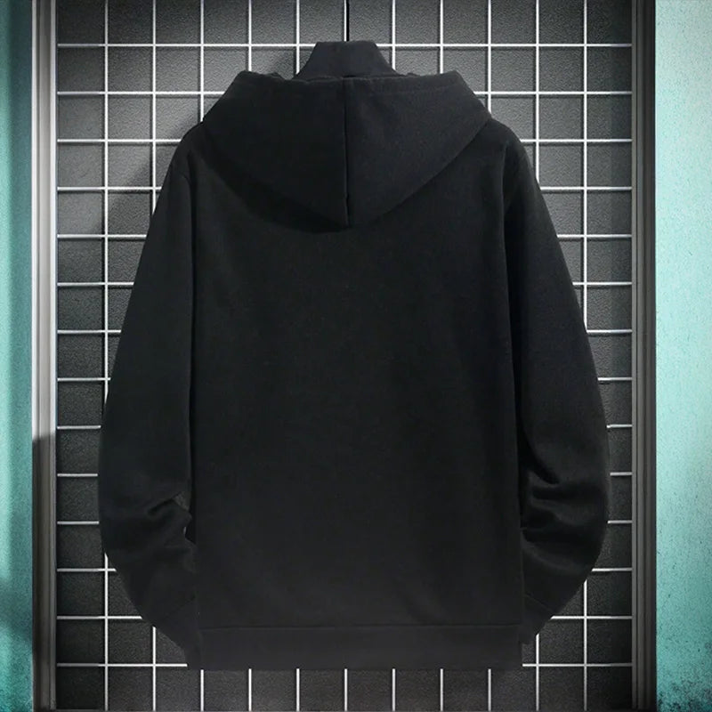 Black hoodie on a tiled wall background