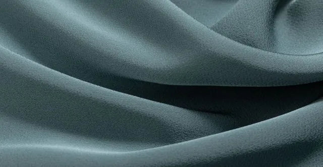 Close-up of textuRed teal fabric with folds