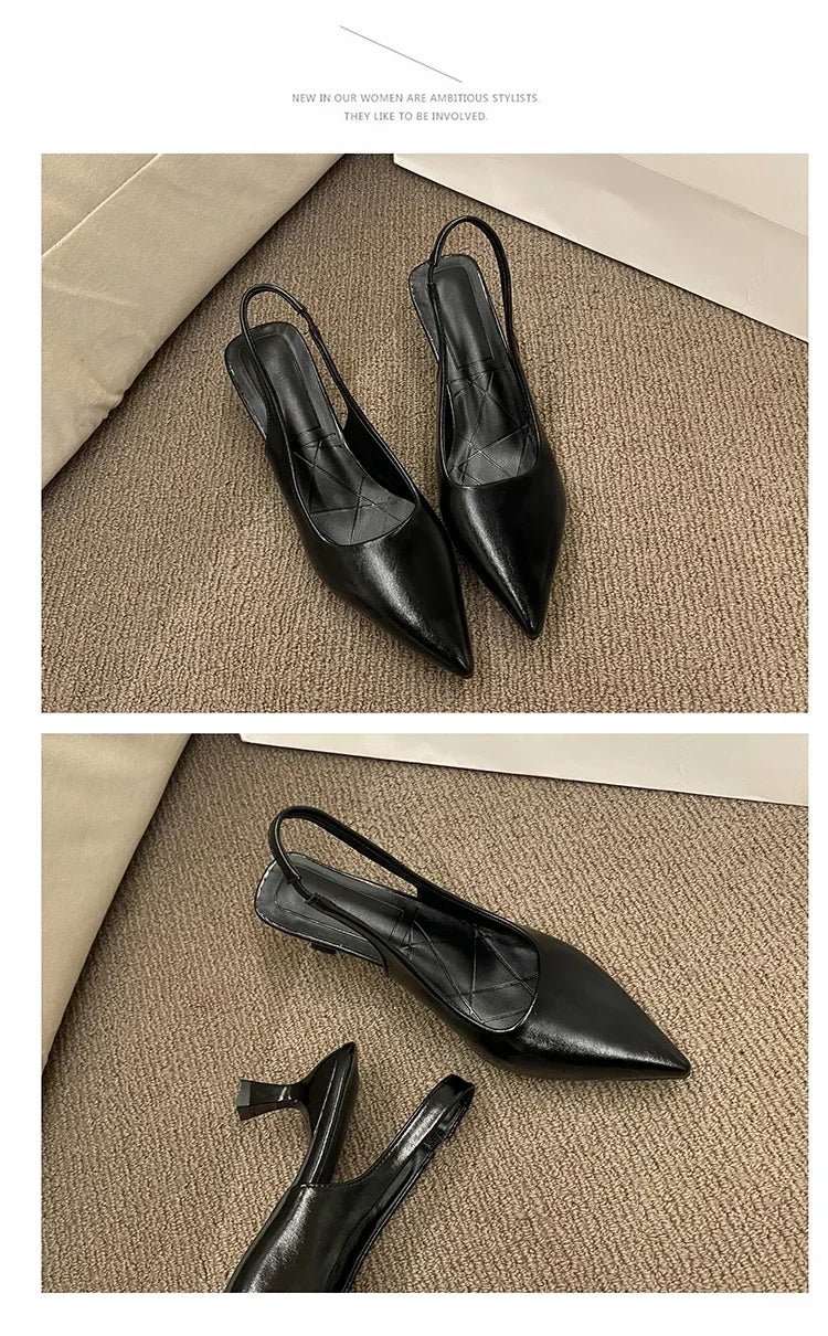 Black pointed-toe shoes on a textuRed beige surface