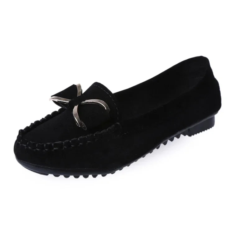 Black loafer shoe with a bow on a White background