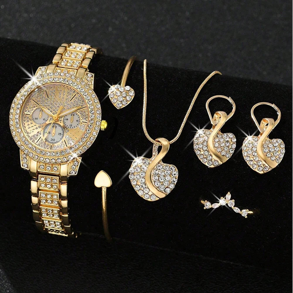 Gold jewelry set including a watch, necklace, and earrings on a Black background