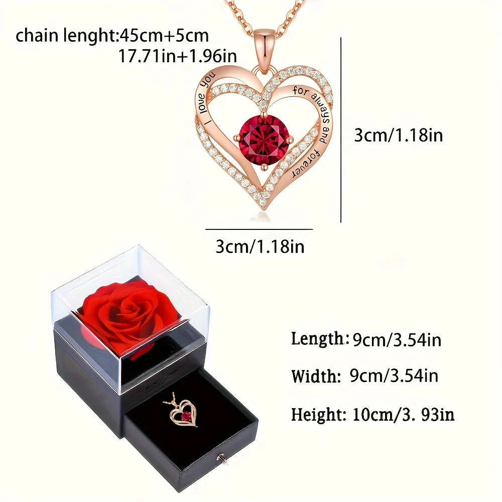 Heart-shaped necklace with Red gemstone and rose in a box, measurements displayed.