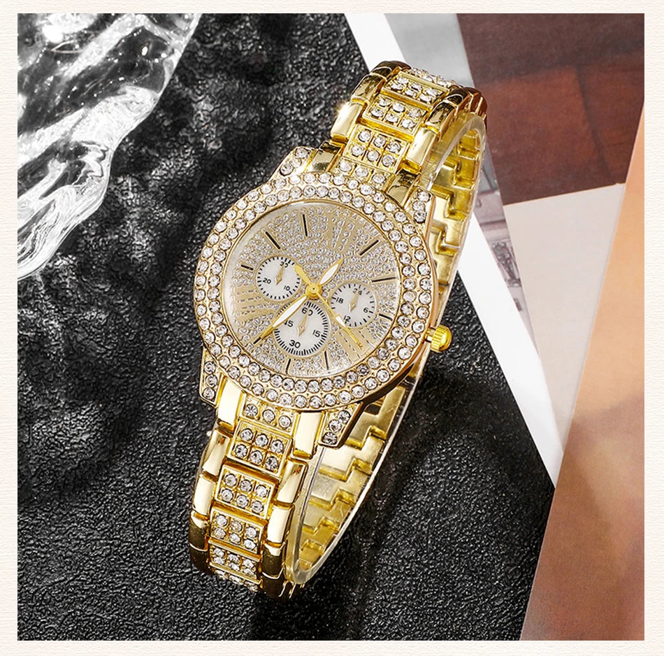 Gold wristwatch with diamond-studded band on a dark textuRed surface
