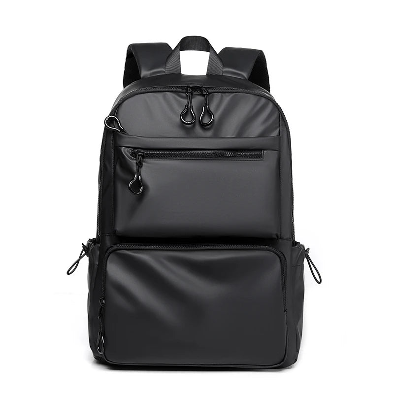 Black waterproof laptop backpack — front view with zip pockets and top handle from Atlantis