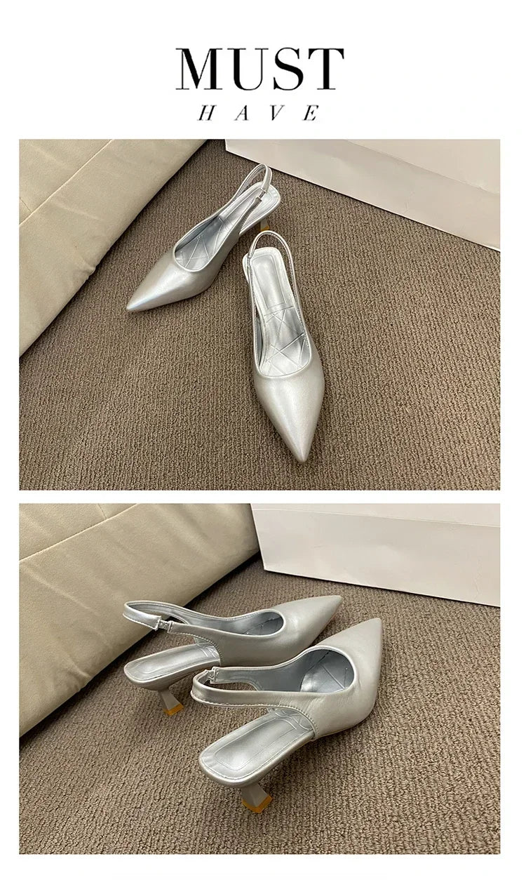 Silver high-heeled shoes on a textuRed surface with 'MUST HAVE' text above.