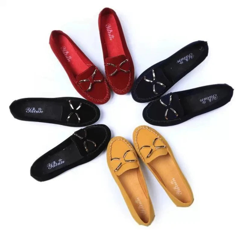 Set of Red, Black, and yellow loafers arranged in a circular pattern on a White background.