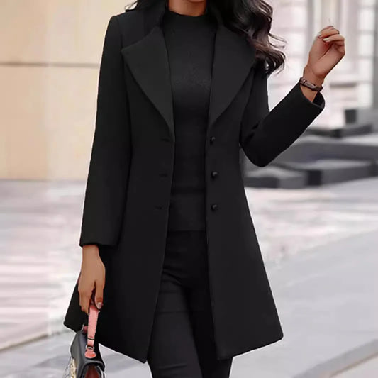 Person wearing a Black coat in an urban setting