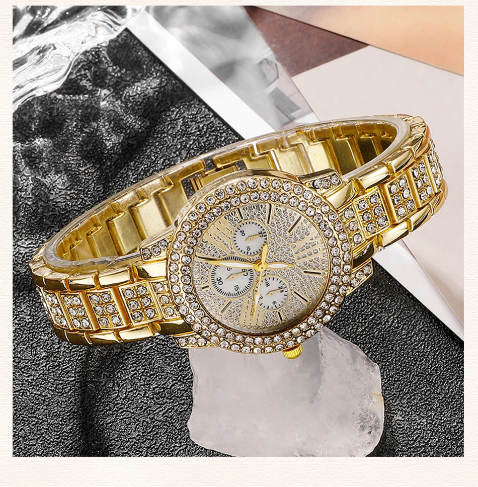 Gold wristwatch with diamond-studded face on a textuRed surface