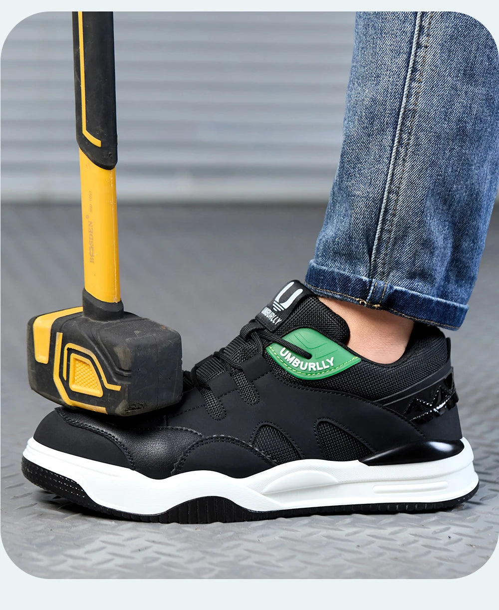 Black safety shoes with a Green label being hammeRed by a yellow sledgehammer on a Gray surface.