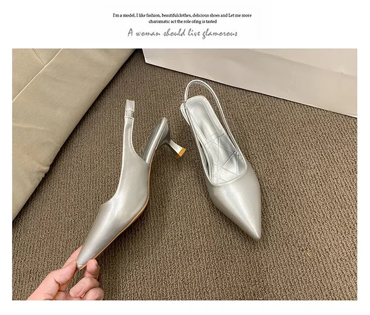 Silver high-heeled shoes being held on a textuRed surface with text overlay.