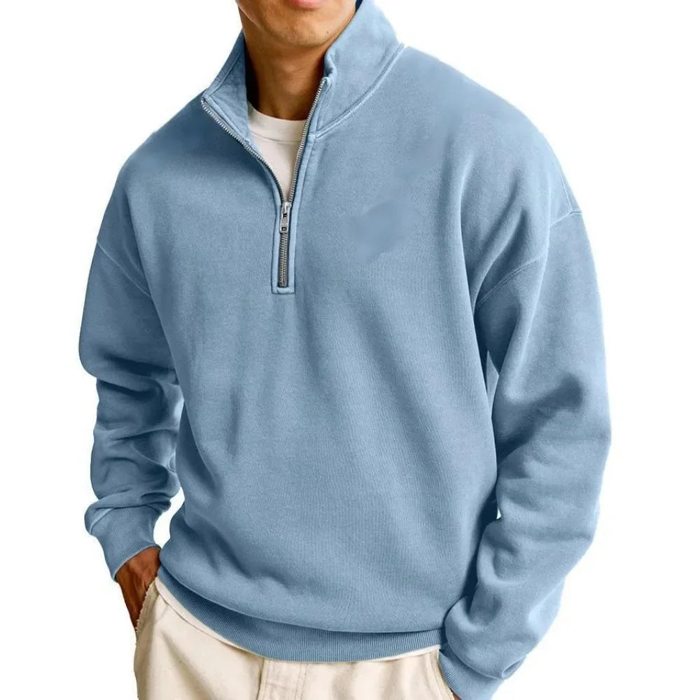 Light blue pullover with a quarter zip on a white background