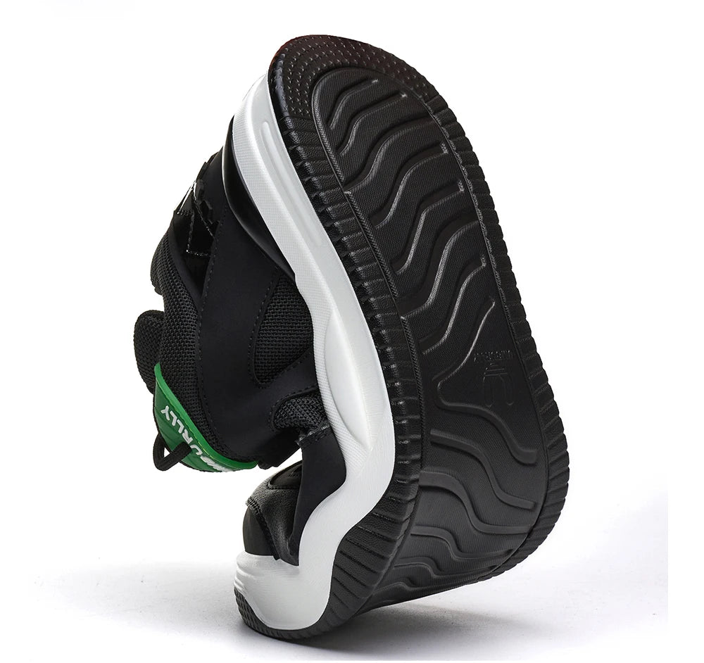 Black and White athletic shoe with Green accent on a White background