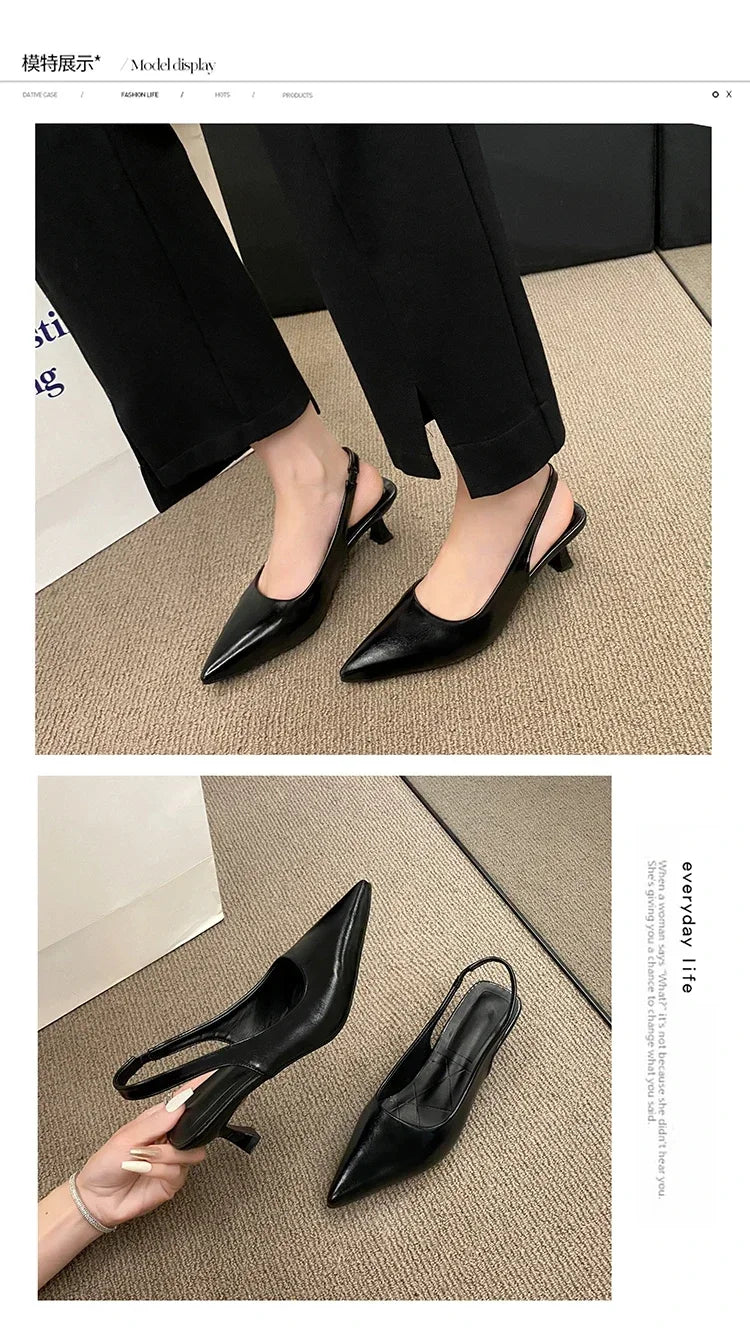 Black high-heeled shoes with pointed toes on a textuRed surface.