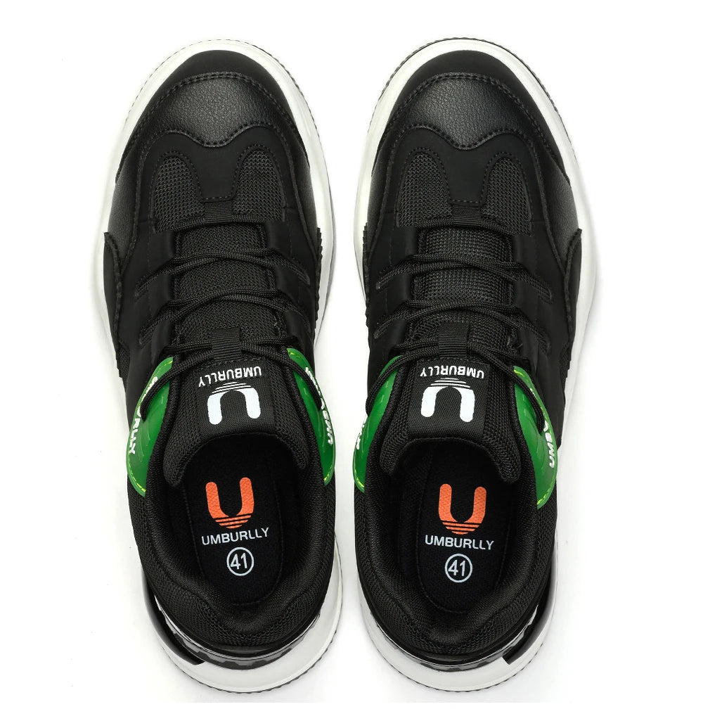 Black sneakers with Green and orange accents on a White background
