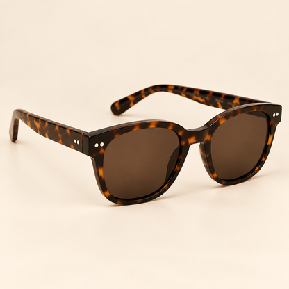Vintage tortoiseshell sunglasses alternate three-quarter view on warm cream background