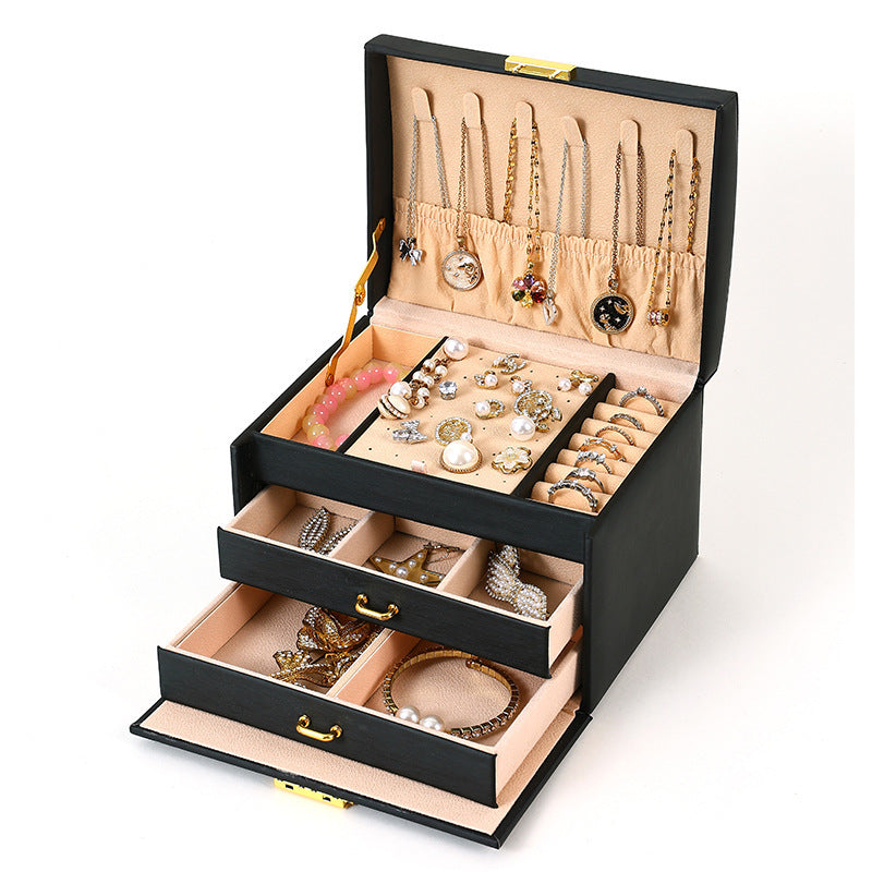 Black travel jewelry organizer open with storage compartments