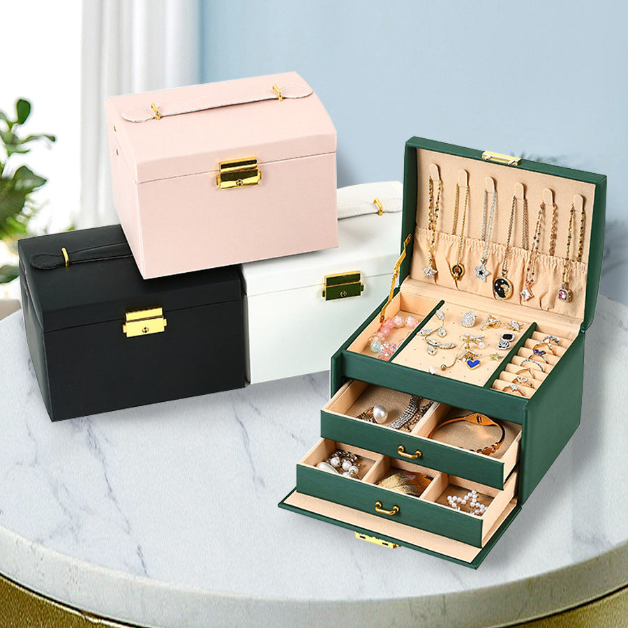 Green travel jewelry organizer open with storage compartments
