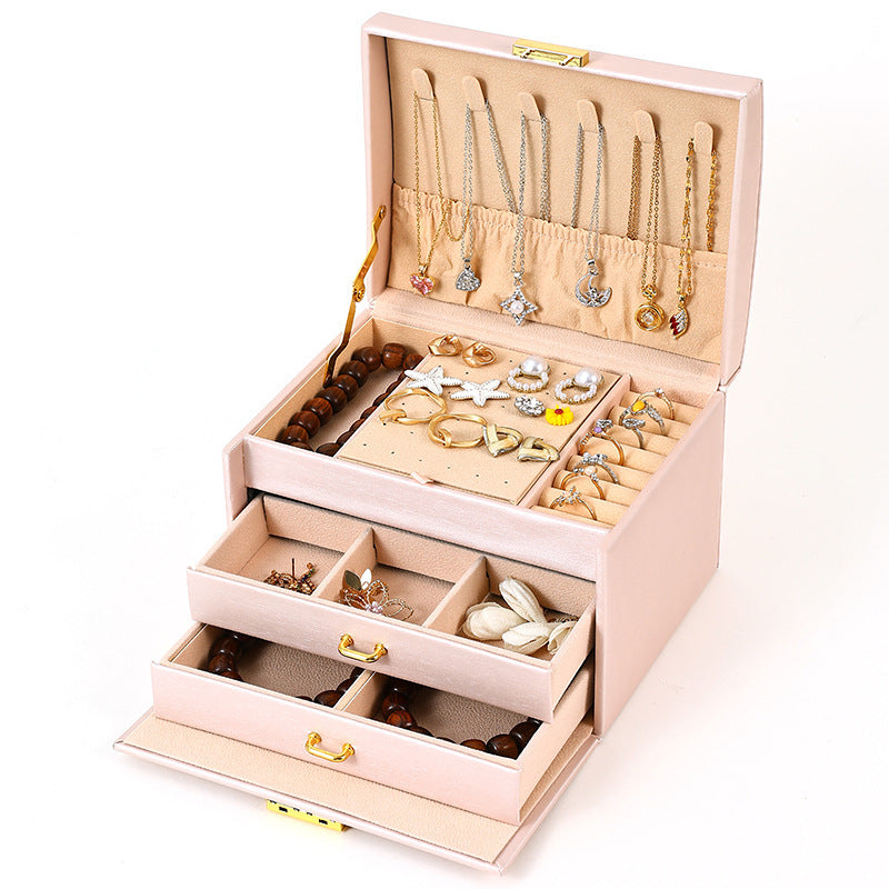 Pink travel jewelry organizer open with jewelry storage compartments