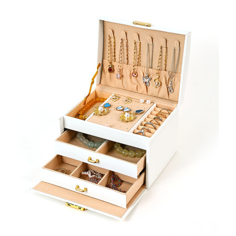 White travel jewelry organizer open with jewelry storage compartments